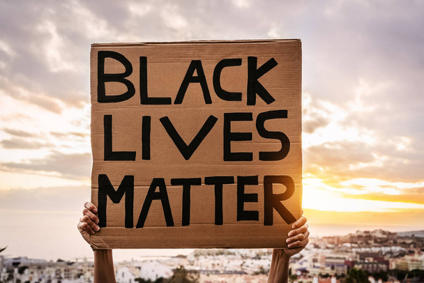 Black lives matter banner - Activist movement protesting against racism and fighting for equality - Social protests and human rights concept - Photo, Image