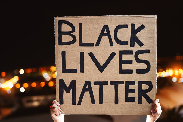 Black lives matter banner - Activist movement protesting against racism and fighting for equality - Social protests and human rights concept - Photo, Image