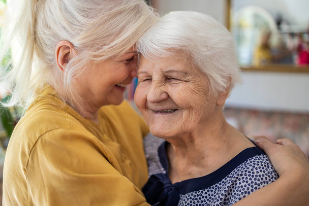 Woman spending time with her elderly mother - Photo, Image