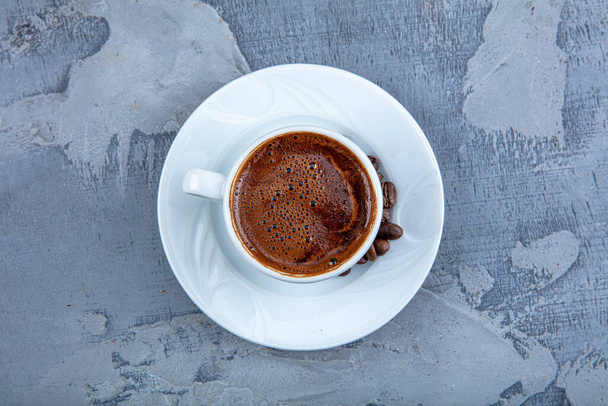 Delicious Turkish Coffee served with chocolate in traditional cup , close up shot. - Photo, Image