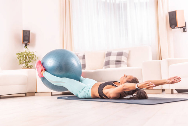 Abs and core female workout on a mat at home using fitball.  - Foto, Imagem
