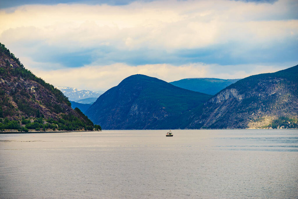 Fjord landscape with ship in Norway, Scandinavia Europe. Tourism vacation and travel - 写真・画像