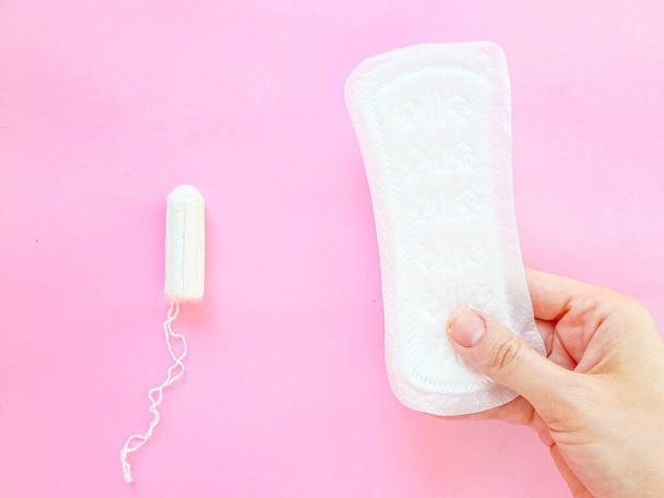 Intimate feminine hygiene products. The daily tampon and sanitary pads. Menstrual cycle. - 写真・画像
