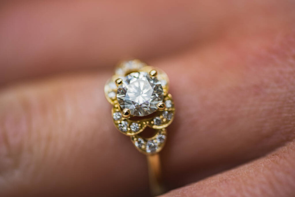 A close up of a beautiful gold diamond engagement ring - Photo, Image