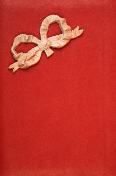 Pink bow on red leather - Zdjęcie, obraz