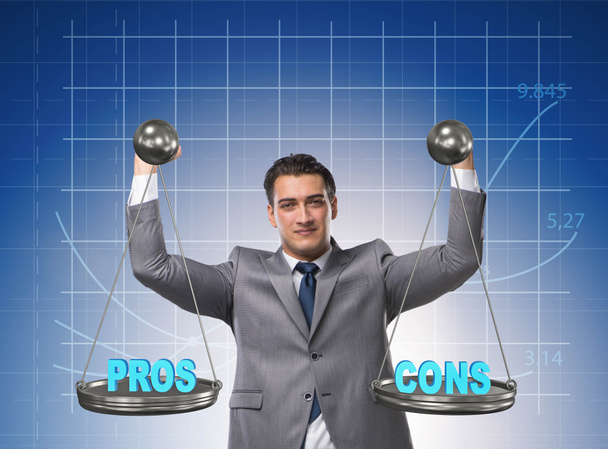 Businessman choosing pros and cons - Photo, Image