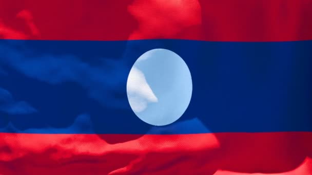 The national flag of Laos is flying in the wind - Πλάνα, βίντεο