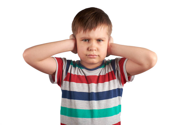 stubborn young kid, covering his closed ears,ignores what they say, asking for silence, isolated on white background - Foto, immagini