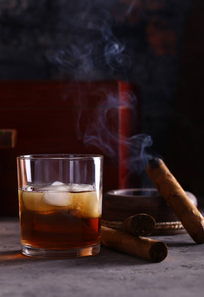 still life with cigars and alcohol men's history - 写真・画像