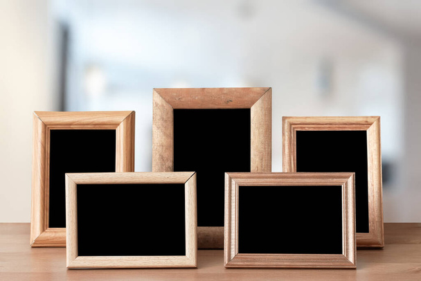 photo frames on the wooden table in the living room - Fotoğraf, Görsel