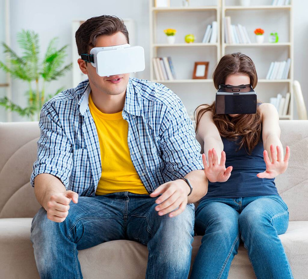 Young family playing games with virtual reality glasses - Fotografie, Obrázek