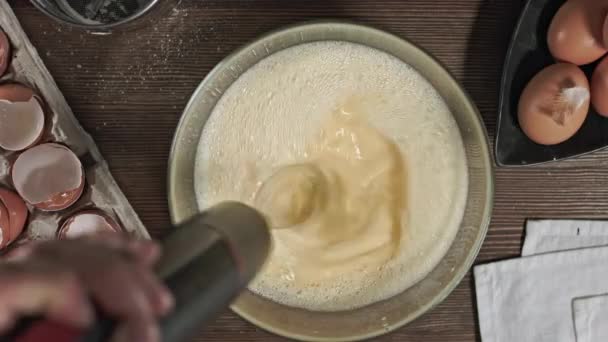 Kneading the dough. The process of making a delicious treat or dessert. Ingredients for baking on the table. Top plan for chef cook. Home cooking with care for relatives. - Footage, Video