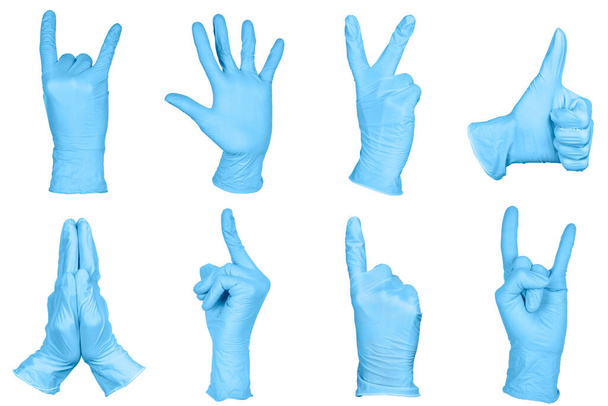 Набор рук или знаки жестов в синих одноразовых латексных хирургических перчатках, изолированных на белом фоне. Набор знаков
. - Фото, изображение