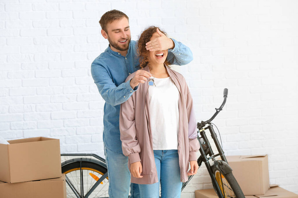 Young couple in their new flat on moving day - Photo, Image