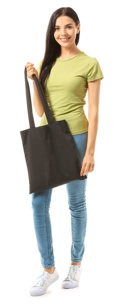 Young woman with eco bag on white background - Φωτογραφία, εικόνα