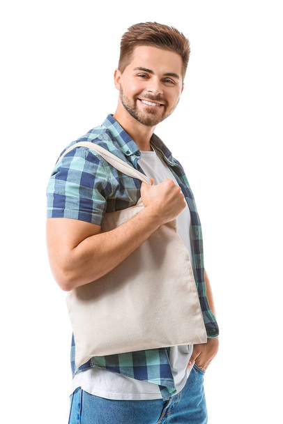 Young man with eco bag on white background - Zdjęcie, obraz