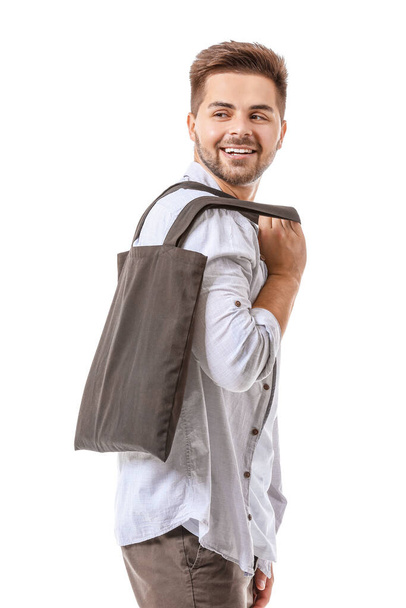 Young man with eco bag on white background - Photo, Image