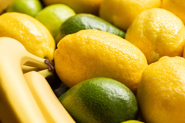 close up view of colorful yellow and green delicious summer fruits - Foto, afbeelding