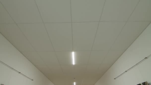 Camera movement and look up, white ceiling with lighting. POV - Footage, Video