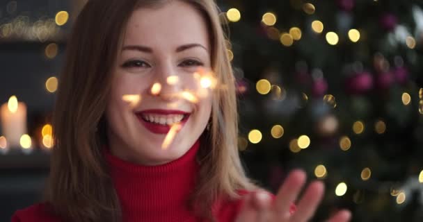 Woman celebrating Christmas or new year eve - Footage, Video