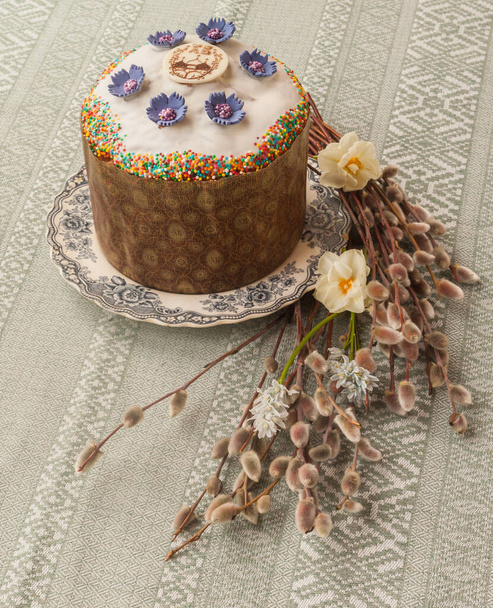 Traditional Kulich with   icing and willow twigs. Palm Sunday. - Photo, Image