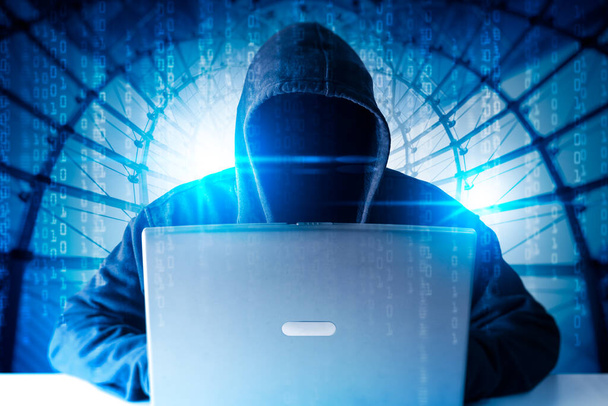 the hacker using a laptop computer - Fotó, kép