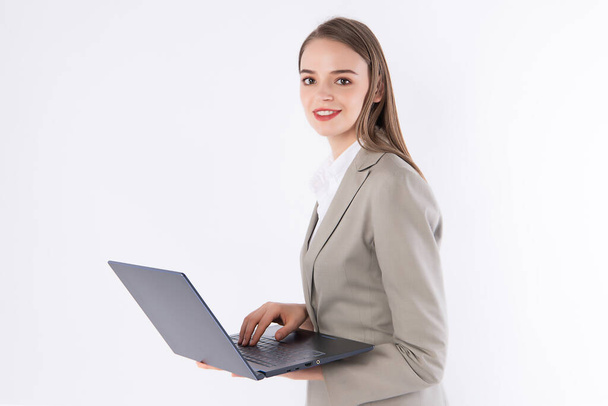 Working woman is working on her labtop with smart outfit. - Zdjęcie, obraz