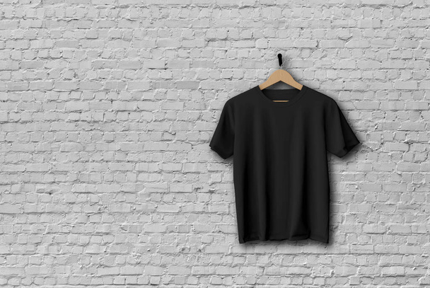 Black t-shirt mock up hanging against a brick wall 3D Rendering - Foto, Imagen