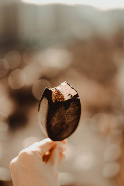Delicious chocolate ice cream on a hot sunny day - Foto, Imagen
