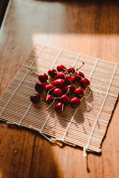 Delicious cherry on a hot sunny day - Zdjęcie, obraz