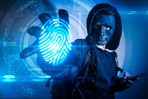 The abstract image of the hacker using a smartphone computer and reach hand for stealing the fingerprint hologram. the concept of cyber attack, virus, malware, illegally and cyber security. - Photo, Image