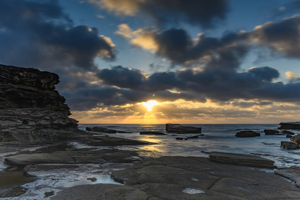 Capturing the sunrise from The Skillion at Terrigal on the Central Coast, NSW, Australia. - Valokuva, kuva