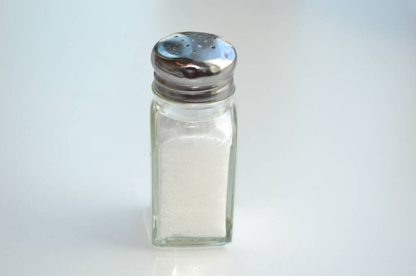 Polaris, Ohio-USA június 15,2019: Salt and Pepper shakers isolated on Diner counter. - Fotó, kép