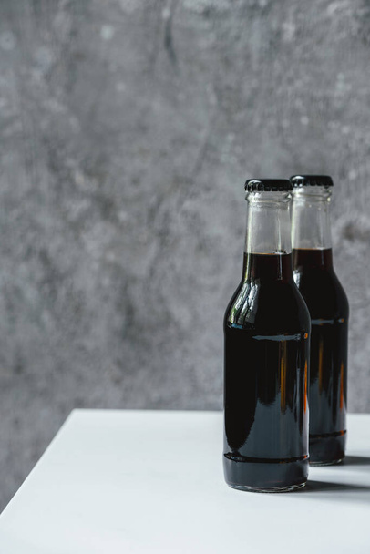 cold brew coffee in bottles on white table - Foto, Bild