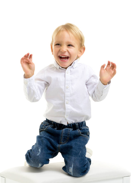 Handsome little boy laughing.The concept of a happy childhood - Fotó, kép