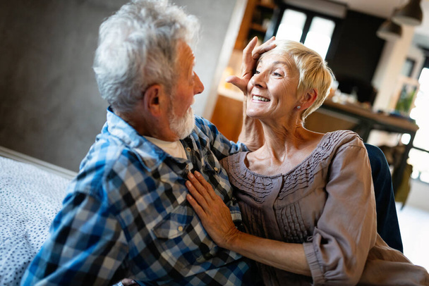 Happy smiling senior couple in love hugging and bonding with true emotions at home - Foto, Bild