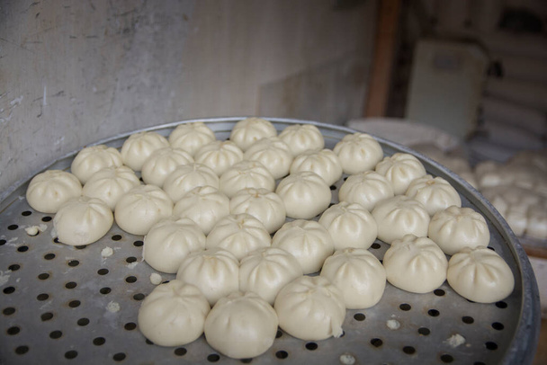 "Baozi", a traditional Chinese dumplings. At the market of Dali, Yunnan, China - Photo, Image
