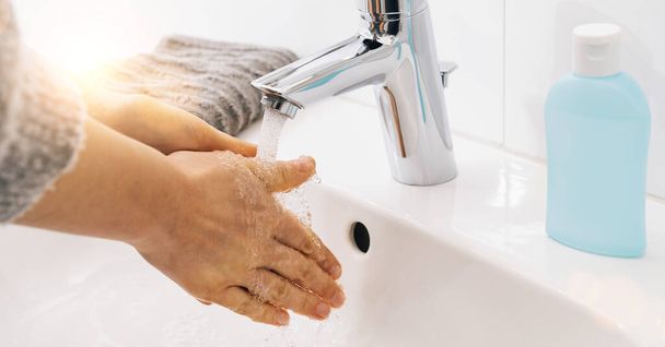 Woman washing his Hands to prevent virus infection and clean dirty hands - coronavirus  Sars-CoV-2 covid-19 concept image - Φωτογραφία, εικόνα