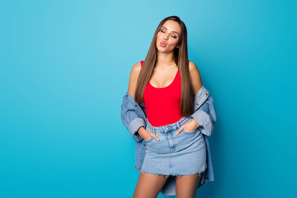 Portrait of charming attractive sweet lovely girl put hands pockets have 14-february celebration holiday send air kiss wear shine singlet isolated over blue color background - Photo, Image
