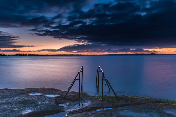 Purple shades of dawn at Tuggerah Lake, Pipeclay Point, Gorokan on the Central Coast of NSW, Australia. - Foto, Imagen