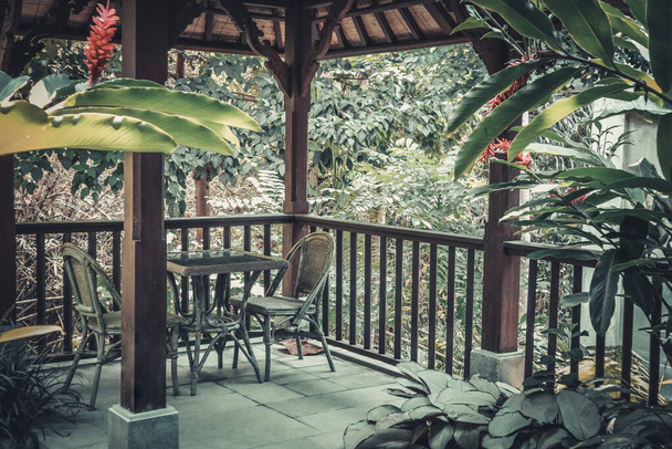View from luxury hotel room on terrace with gazebo and jungle. - Φωτογραφία, εικόνα
