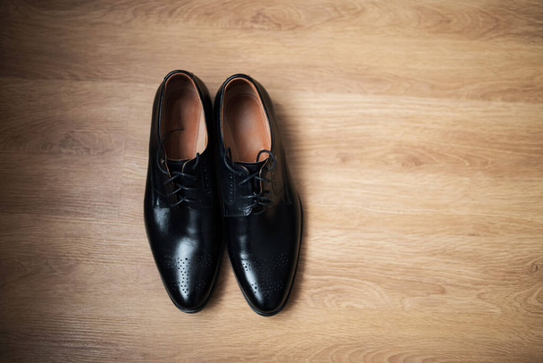 black men shoes on wooden background - Photo, Image