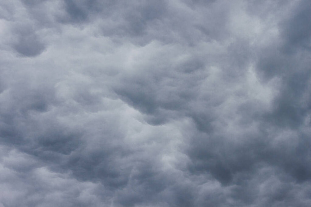 Stormy dark cloudy sky before rain texture background. - Photo, Image