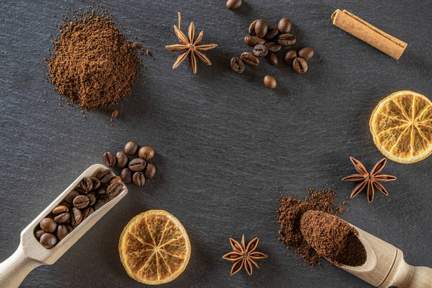 Cafe coffee background. Espresso beans for food, drink caffeine breakfast on black. Brown roasted coffee seeds isolated for energy mocha, cappuccino ingredient. Copy space, top view. - Photo, Image