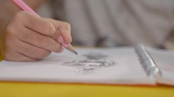 kids hand drawing in the book - Video