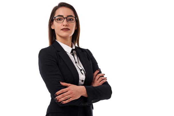 Closeup of an attractive teacher or secretary in glasses over white background - Fotó, kép
