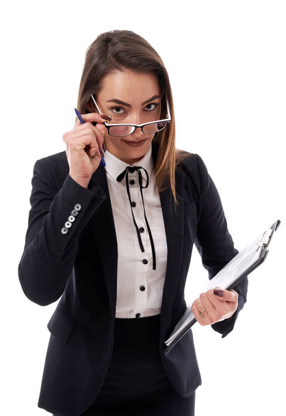 Young latin busiensswoman in glasses with a clipboard and documents - Foto, Imagen