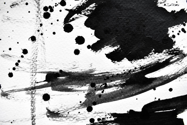 Gotas de tinta negra sobre papel blanco
 - Foto, imagen