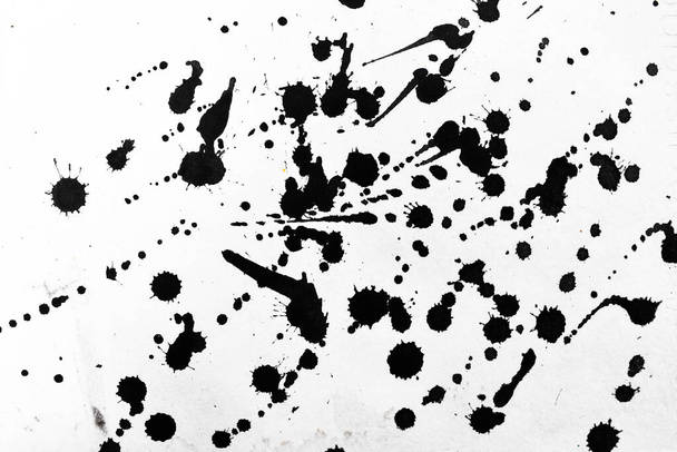 Achtergrond splash zwart op papier. Creatieve abstracte kunst van inkt en aquarel. - Foto, afbeelding