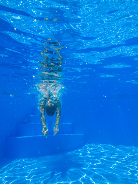 Underwater woman in swimming pool. - Photo, image